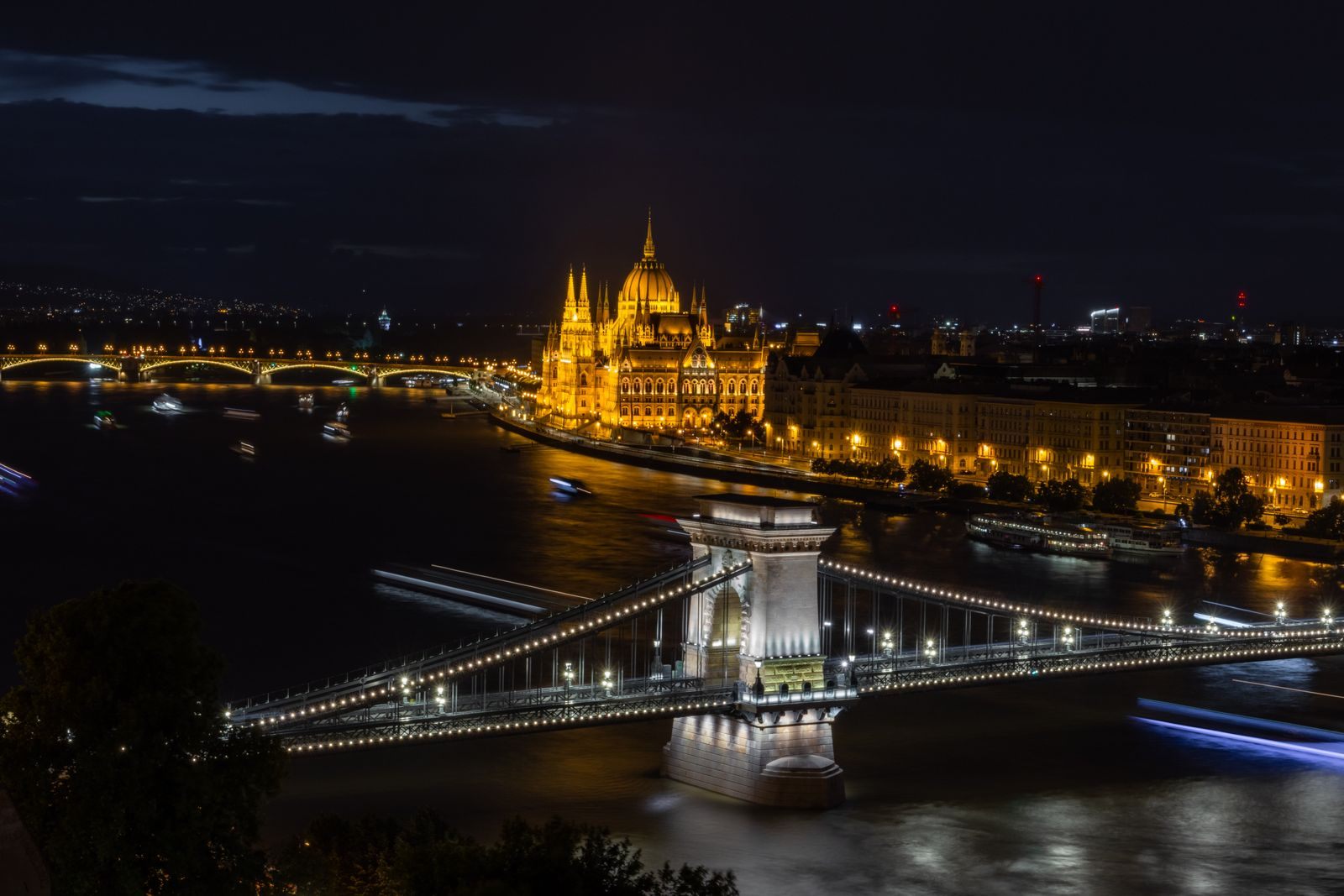 Chain Bridge and the Hungarian Parliament lit up over the Danube at night, a highlight of the world’s best river cruises